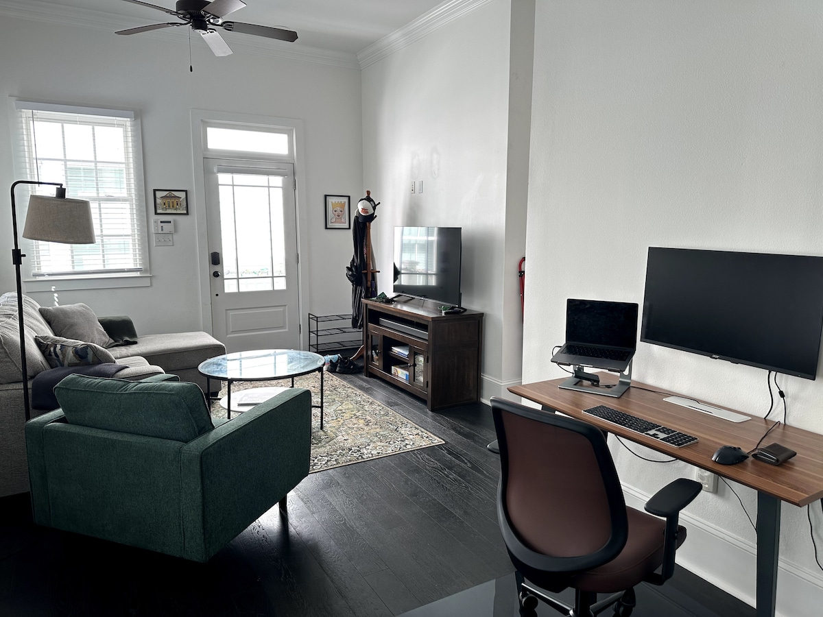 Living room with dedicated workspace and monitor