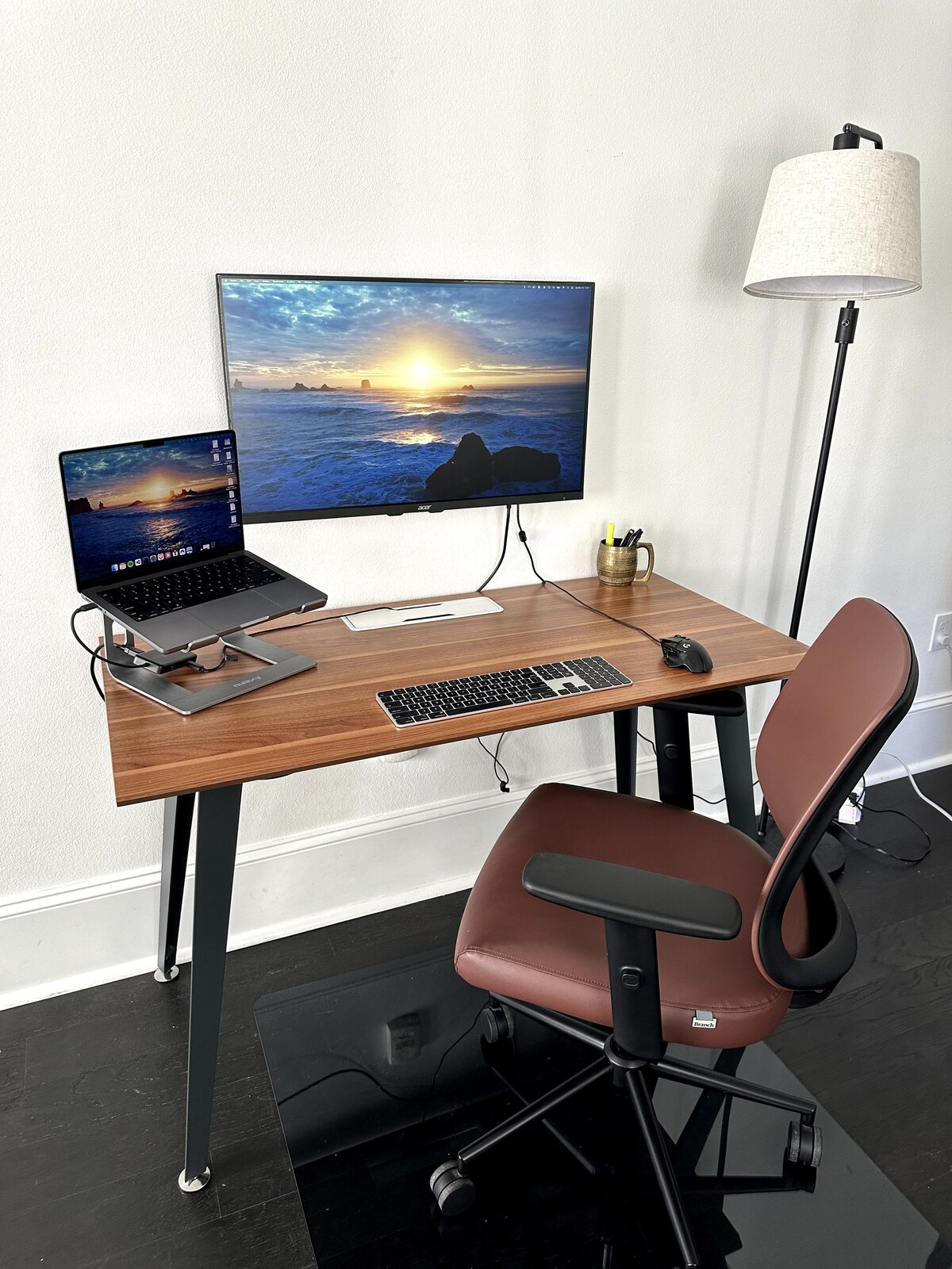 Dedicated work-from-home desk with laptop, monitor, keyboard, mouse, and task chair